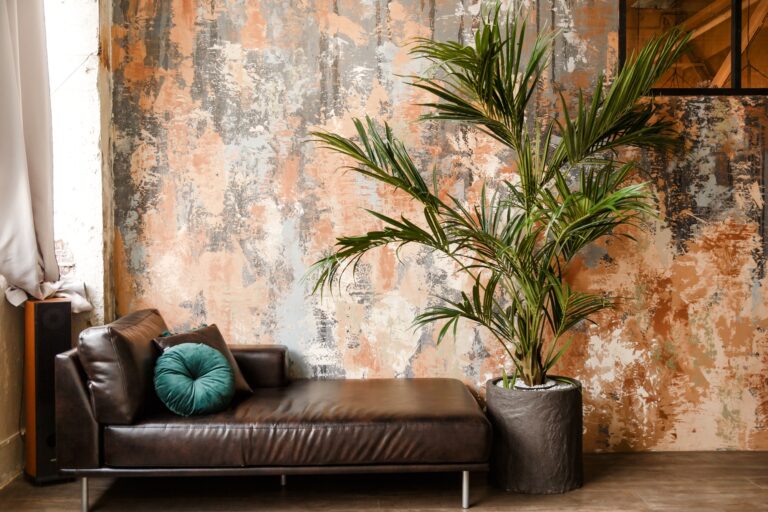 Modern leather couch and big houseplant in loft room