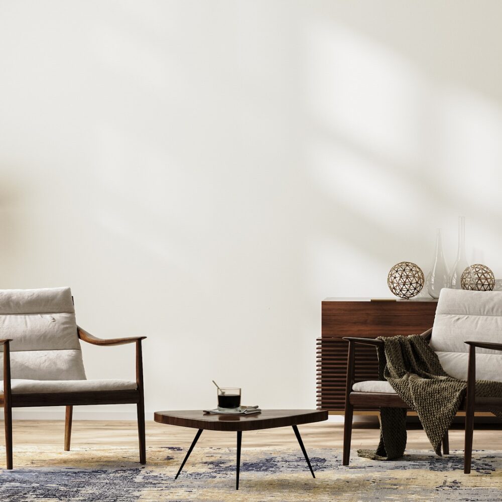 Bright modern living room interior in neutral colors with armchairs