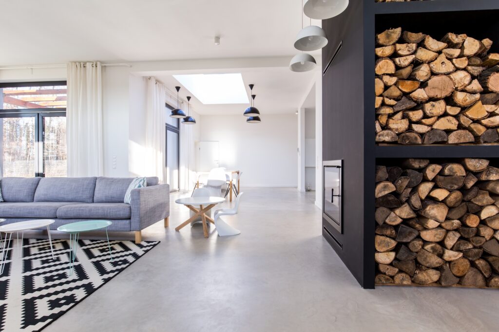 White living room in modern minimalist house with concrete floor
