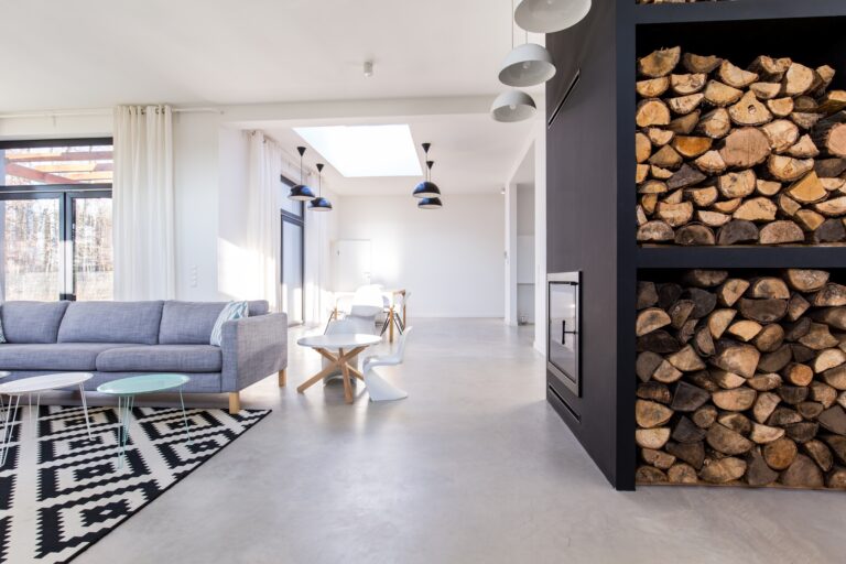 White living room in modern minimalist house with concrete floor